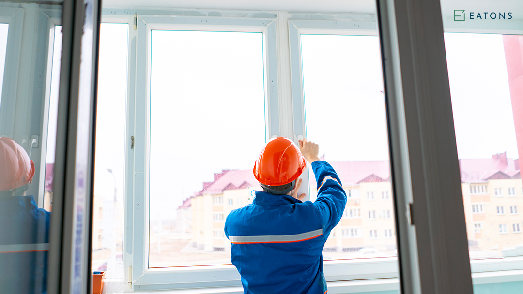 A Man Installing a Custom Window